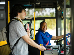 VIA rider paying at the fare box